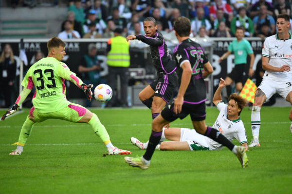 Bayern Munich's German midfielder #10 Leroy Sane (2L) shoots past Moenchengladbach's German goalkeeper #33 Moritz Nicolas (L) to score the 1-1 goal during the German first division Bundesliga football match between Borussia Moenchengladbach v FC Bayern Munich in Moenchengladbach, western Germany, on September 2, 2023. (Photo by UWE KRAFT / AFP) / DFL REGULATIONS PROHIBIT ANY USE OF PHOTOGRAPHS AS IMAGE SEQUENCES AND/OR QUASI-VIDEO 