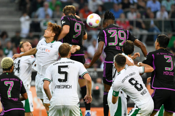 Bayern Munich's French forward #39 Mathys Tel (top R) heads the ball to score the 2-1 goal during the German first division Bundesliga football match between Borussia Moenchengladbach v FC Bayern Munich in Moenchengladbach, western Germany, on September 2, 2023. (Photo by UWE KRAFT / AFP) / DFL REGULATIONS PROHIBIT ANY USE OF PHOTOGRAPHS AS IMAGE SEQUENCES AND/OR QUASI-VIDEO 